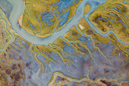 Aerial view of the abstract pattern made by Scheldt river estuaries near Belgium and The Netherlands border, Nieuw-Namen, Zeeland, The Netherlands.