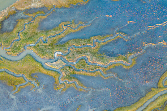 Aerial view of the abstract pattern made by Scheldt river estuaries near Belgium and The Netherlands border, Nieuw-Namen, Zeeland, The Netherlands.