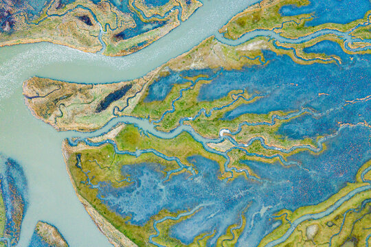 Aerial view of the abstract pattern made by Scheldt river estuaries near Belgium and The Netherlands border, Nieuw-Namen, Zeeland, The Netherlands.