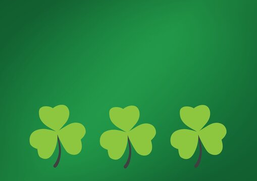 Digital generated image of three shamrocks with copy space against green background