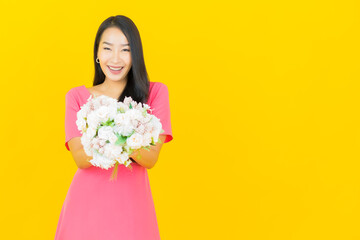 Portrait beautiful young asian woman smile with flower