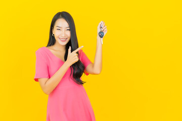 Portrait beautiful young asian woman smile with car key