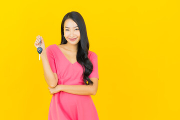 Portrait beautiful young asian woman smile with car key