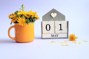 Calendar for May 1: cubes with the numbers 0 and 1, the name of the month of May in English, a...