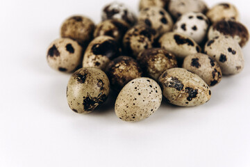 Quail eggs on the white background