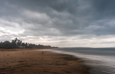 sunset over the beach during raining