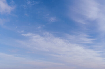 Abstract template with blue sky, white clouds and waxing half moon. Abstract natural background.