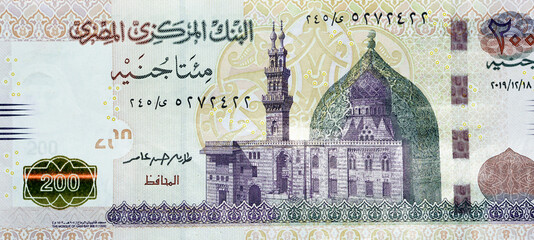 A fragment of the obverse side of 200 Egyptian pounds banknote, obverse side has an image of Mosque...