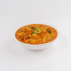 veg mix or veg maratha main course dish in a white bowl on white background