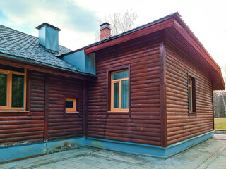 Beautiful wooden house in countryside. Eco-friendly housing, modern construction. Sustainable lifestyle.