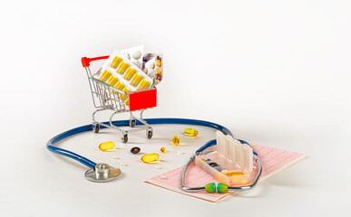 Stethoscope, medical examination cardiogram, health vitamins and pill shopping cart for heart disease. Health care concept.