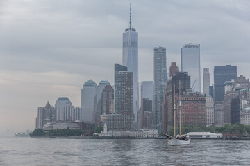 Panoramic view of storm over Lower Manhattan from Ellis Island at dusk, New York City.