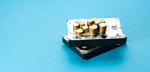 Chia coin. Money on HDD on a blue background. Mining on hard disk drive.