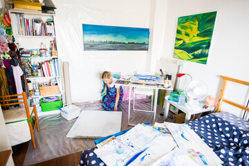 Young artist painter painting canvas studio gallery