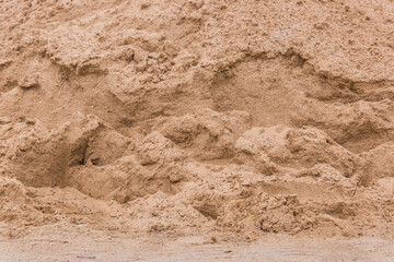Pile of sand texture background at construction site, close-up