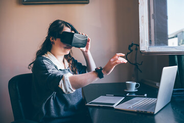 Young caucasian woman using 3D viewer