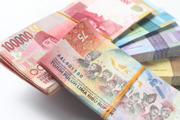 Random Layout Photo Rupiah Paper Money, 10000, 50000, 100000 and 75000 at White Background