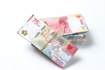 Random Layout Photo Rupiah Paper Money, 10000, 50000, 100000 and 75000 at White Background