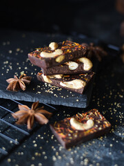 chocolate with nuts on a dark background