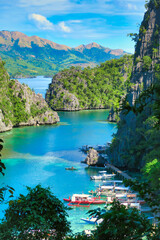 Landscape of hidden crystal clear turquoise water lake in the Philippines and blue ocean in summer