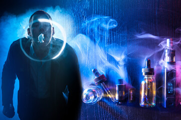 Vaper does the tricks. Rings from the smoke of an electronic cigarette. Man next to vaping devices....