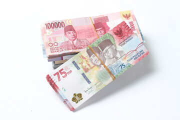 Random Layout Photo Rupiah Paper Money, 10000, 50000, 100000 and 75000 at White Background