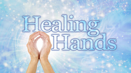 Magical Energy Healing Hands Concept - Female hands cupped making an O with bright white light energy between beside the words Healing Hands   on a light blue sparkling vortex energy field background
