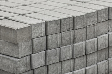 A pile of packed paving stone slabs industrial tile sidewalk materials at a construction site
