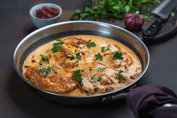 Cajun chicken in a creamy sauce prepared in a pan
