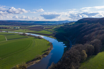 View of drone of landscape of river Weser and village Doelme  in Germany .