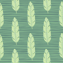 Foliage seamless pattern with light green leaf silhouettes ornament. Green striped background. Simple style.