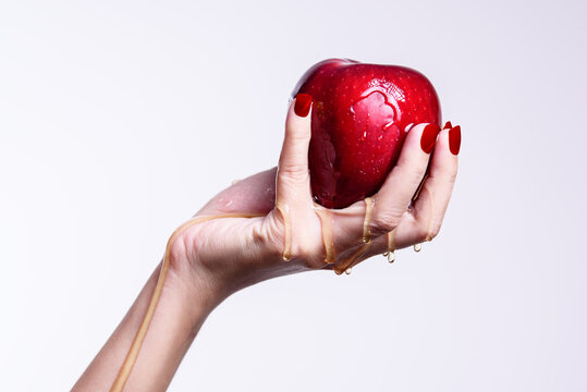woman holding a red apple