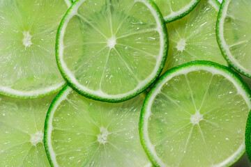 Citrus fruits of Lime slices. Healthy food green background. Realistic flat lay