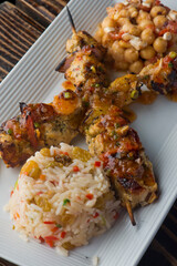 Chicken Kabobs. Cubes of grilled chicken, grilled vegetables, onions bell peppers and seasoned with garlic and spices. Served with rice, traditional classic Greek or Italian restaurant favorite. 