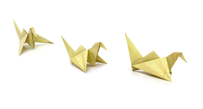 Origami yellow paper bird on white