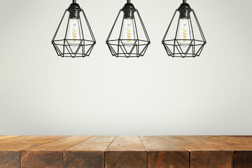 Wooden table of free space and three lamps. 
