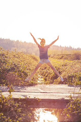 Fototapeta na wymiar Girl jumping for joy 