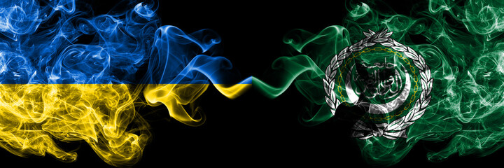 Ukraine, Ukrainian vs Arab League smoky mystic flags placed side by side. Thick colored silky abstract smokes flags.