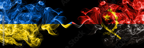 Ukraine, Ukrainian vs Angola, Angolan smoky mystic flags placed side by side. Thick colored silky abstract smokes flags.