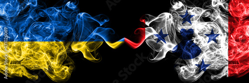 Ukraine, Ukrainian vs Austral Islands smoky mystic flags placed side by side. Thick colored silky abstract smokes flags.