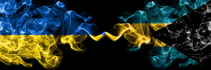 Ukraine, Ukrainian vs Bahamas, Bahamian smoky mystic flags placed side by side. Thick colored silky abstract smokes flags.