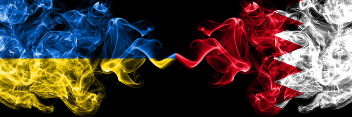 Ukraine, Ukrainian vs Bahrain, Bahraini smoky mystic flags placed side by side. Thick colored silky abstract smokes flags.
