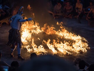 Kecak fire dance art performance show, traditional spiritual culture Ramayana ceremony at Uluwatu Temple Bali Indonesia
