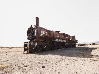 Old historic abandoned train engine locomotive ruins at Cementerio de Trenes cemetery graveyard, Salar de Uyuni Bolivia