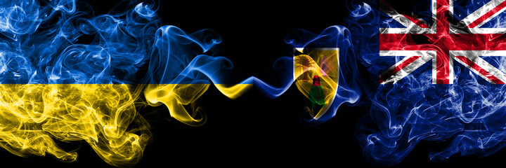 Ukraine, Ukrainian vs British, Britain, Turks and Caicos Islands smoky mystic flags placed side by side. Thick colored silky abstract smokes flags.