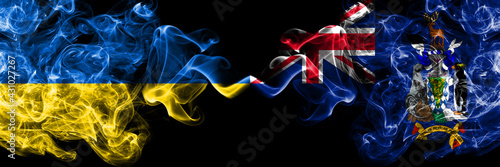 Ukraine, Ukrainian vs British, Britain, South Georgia and the South Sandwich Islands smoky mystic flags placed side by side. Thick colored silky abstract smokes flags.