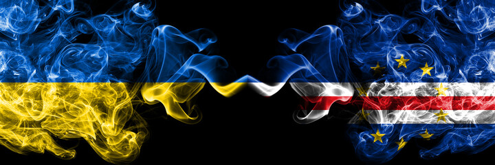 Ukraine, Ukrainian vs Cape Verde, Cabo Verde smoky mystic flags placed side by side. Thick colored silky abstract smokes flags.