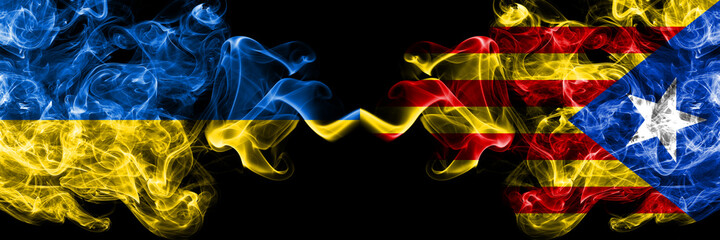 Ukraine, Ukrainian vs Catalonia, Catalan, Catalonian, Spain smoky mystic flags placed side by side. Thick colored silky abstract smokes flags.