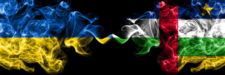 Ukraine, Ukrainian vs Central African Republic smoky mystic flags placed side by side. Thick colored silky abstract smokes flags.