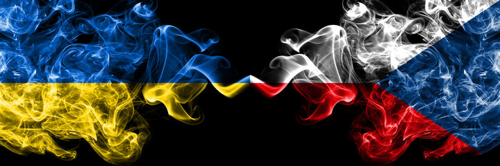 Ukraine, Ukrainian vs Czech Republic smoky mystic flags placed side by side. Thick colored silky abstract smokes flags.